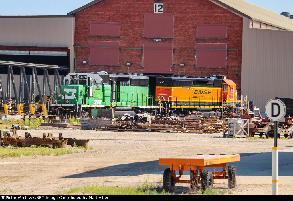 Former BNSF 7810 and former BNSF 6347 outback of the shops